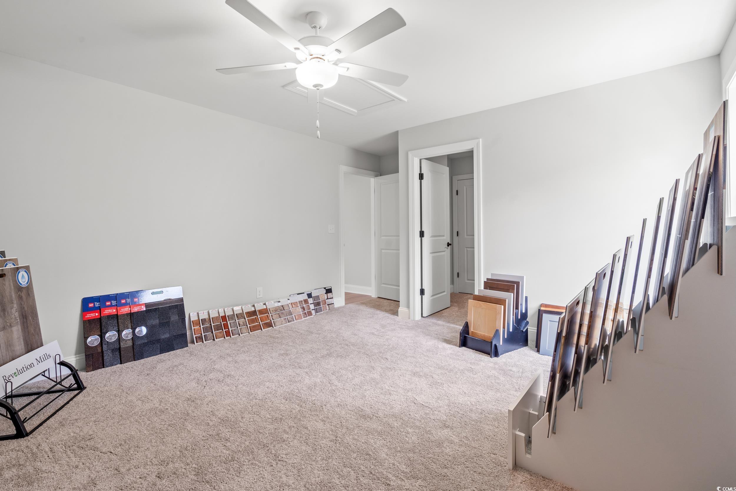 852 Commanders Island Road Georgetown, SC 29440 - Photo 9 of 37 Living area featuring carpet floors and ceiling fan
