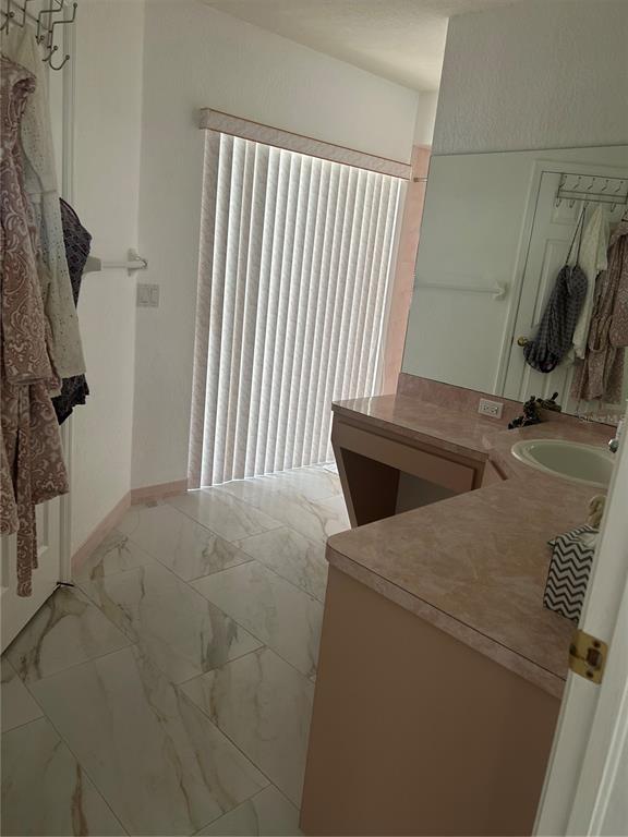 9376 Southern Belle Drive Weeki Wachee, FL 34613 - Photo 11 of 12 a utility room with dryer and washer