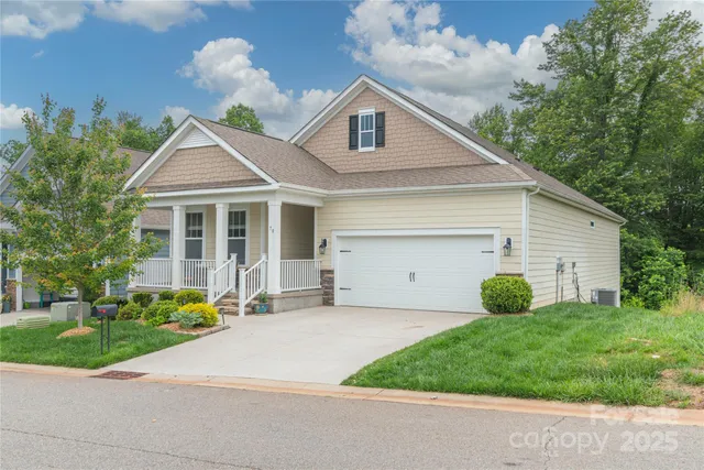 a view of a yard in front view of a house