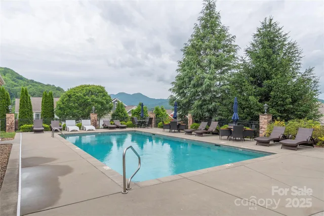 a view of a swimming pool with lounge chair
