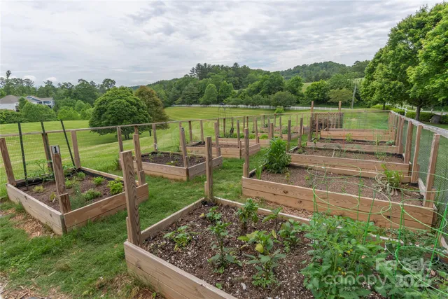 a view of a backyard with wooden floor and lake view