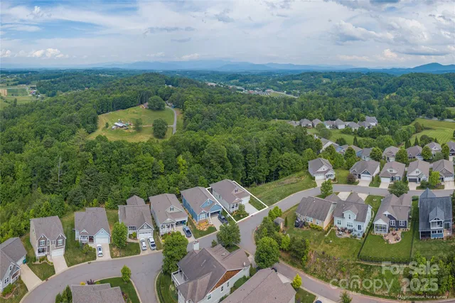 an aerial view of a house with a garden