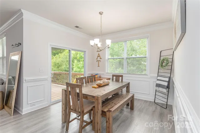 a dining room with furniture window wooden floor