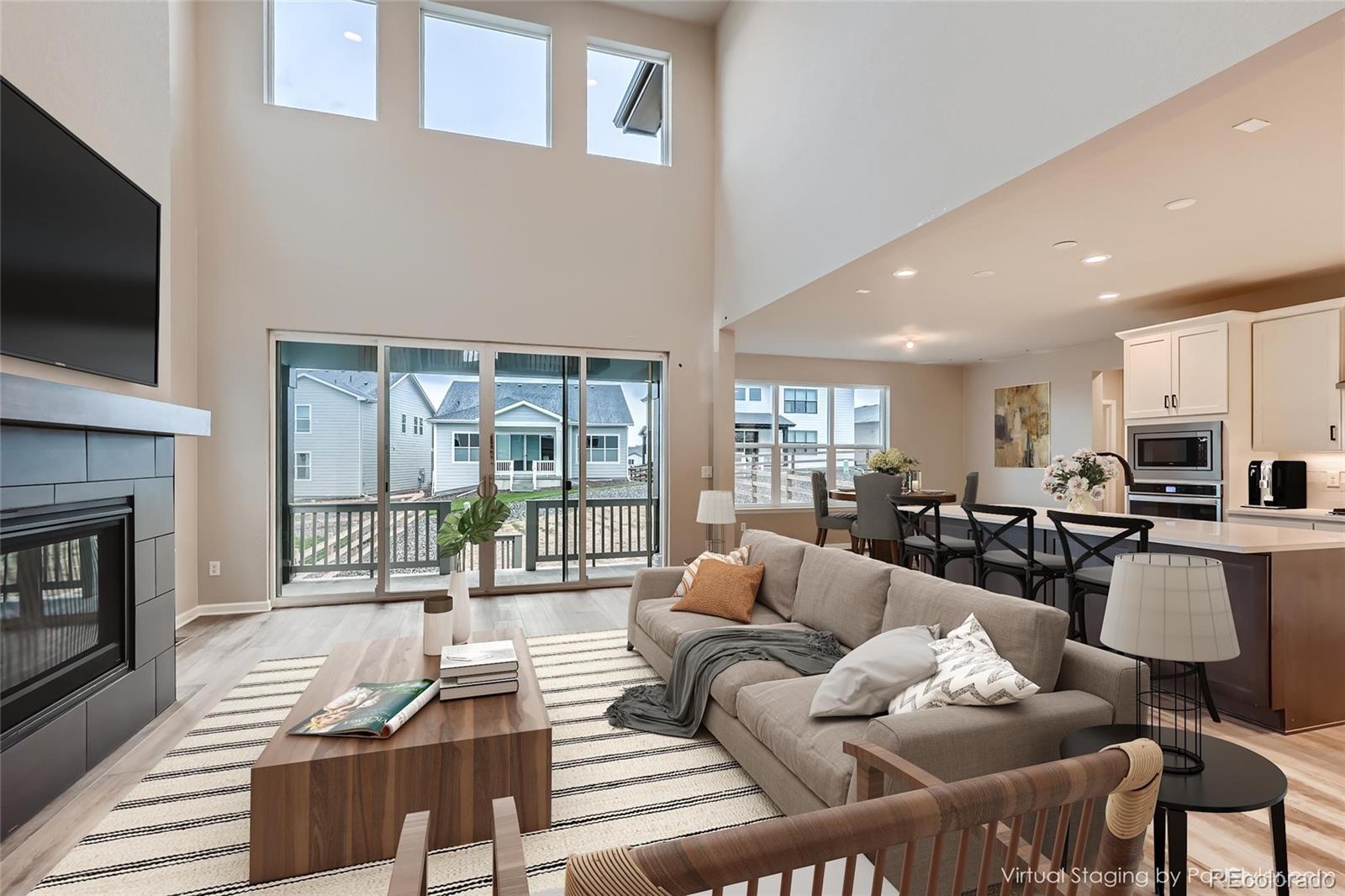 624 Simmental Loop Castle Rock, CO 80104 - Photo 3 of 9 a living room with furniture and a flat screen tv