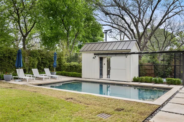 a view of a house with swimming pool