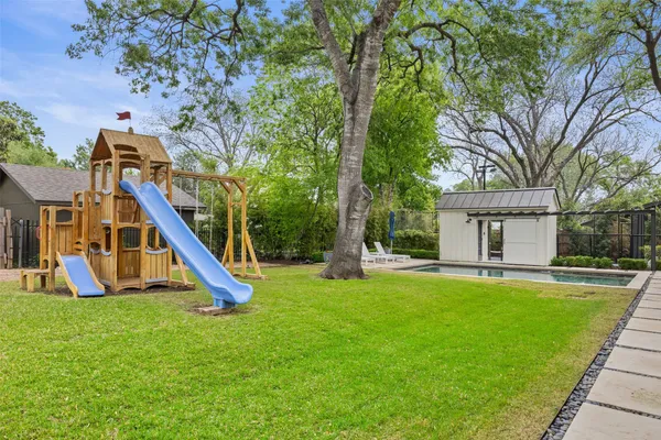 a view of a house with swimming pool and porch