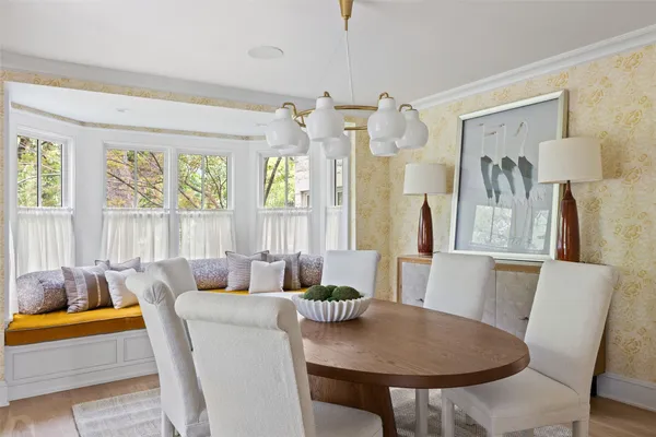 a view of a dining room with furniture and window