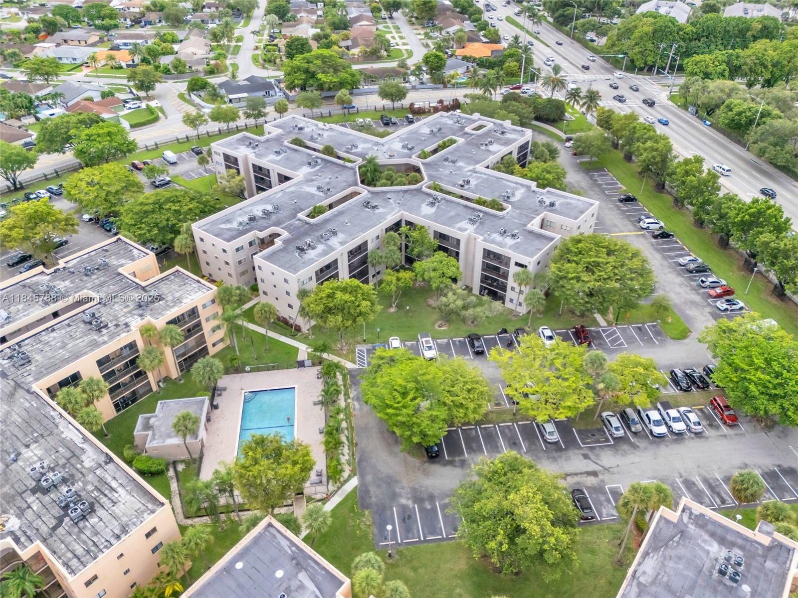 8760 Southwest 133rd Avenue Road, Unit 108 Miami, FL 33183 - Photo 17 of 39 an aerial view of residential houses with outdoor space