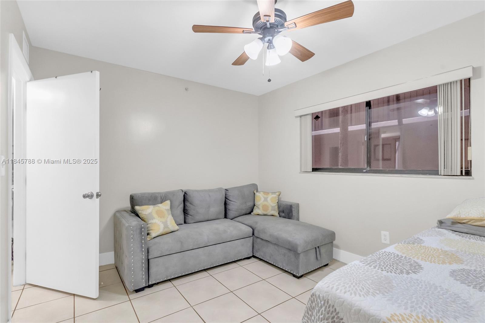 8760 Southwest 133rd Avenue Road, Unit 108 Miami, FL 33183 - Photo 28 of 39 a living room with furniture and a ceiling fan