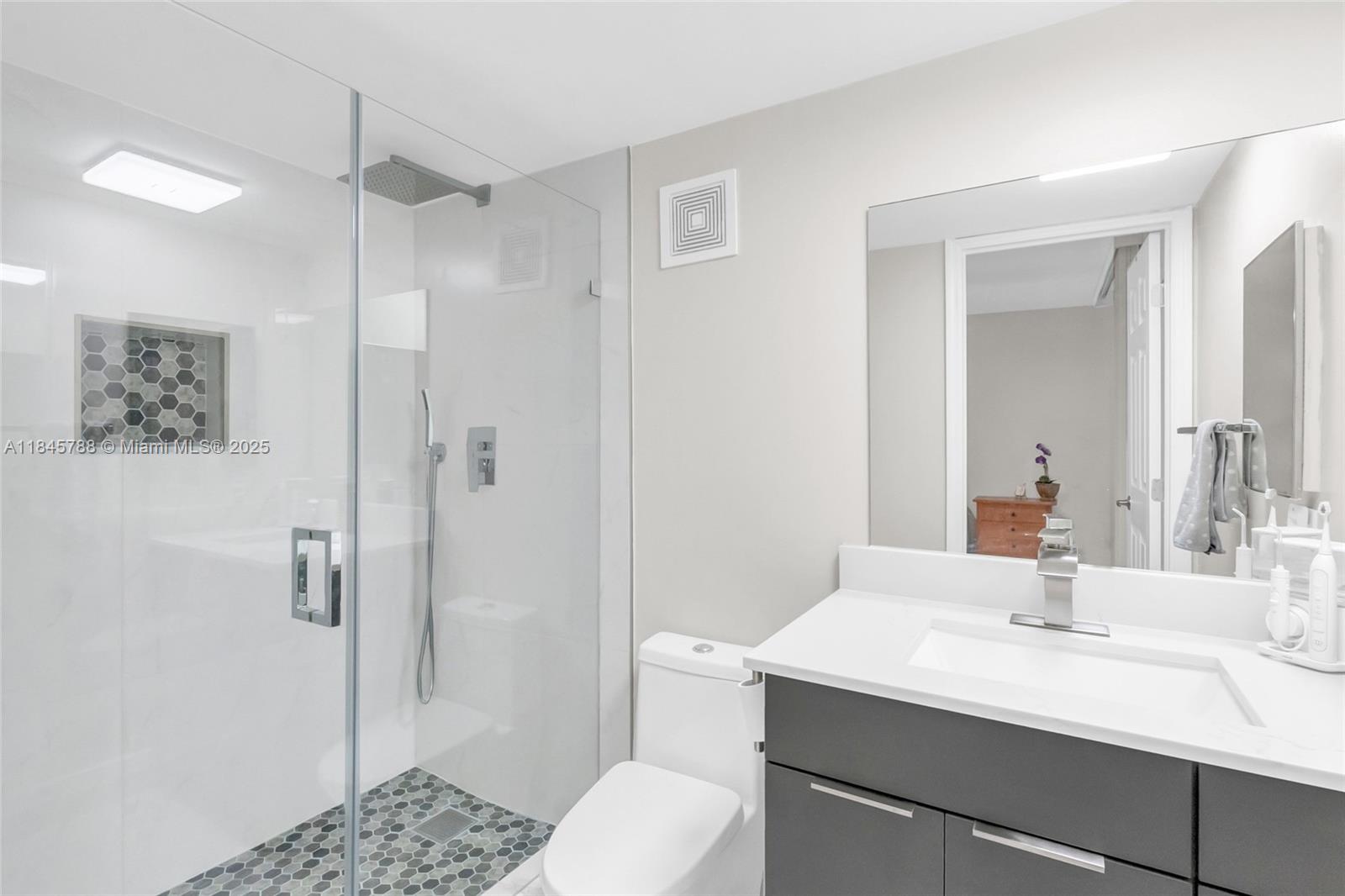 8760 Southwest 133rd Avenue Road, Unit 108 Miami, FL 33183 - Photo 35 of 39 a bathroom with a sink toilet and shower
