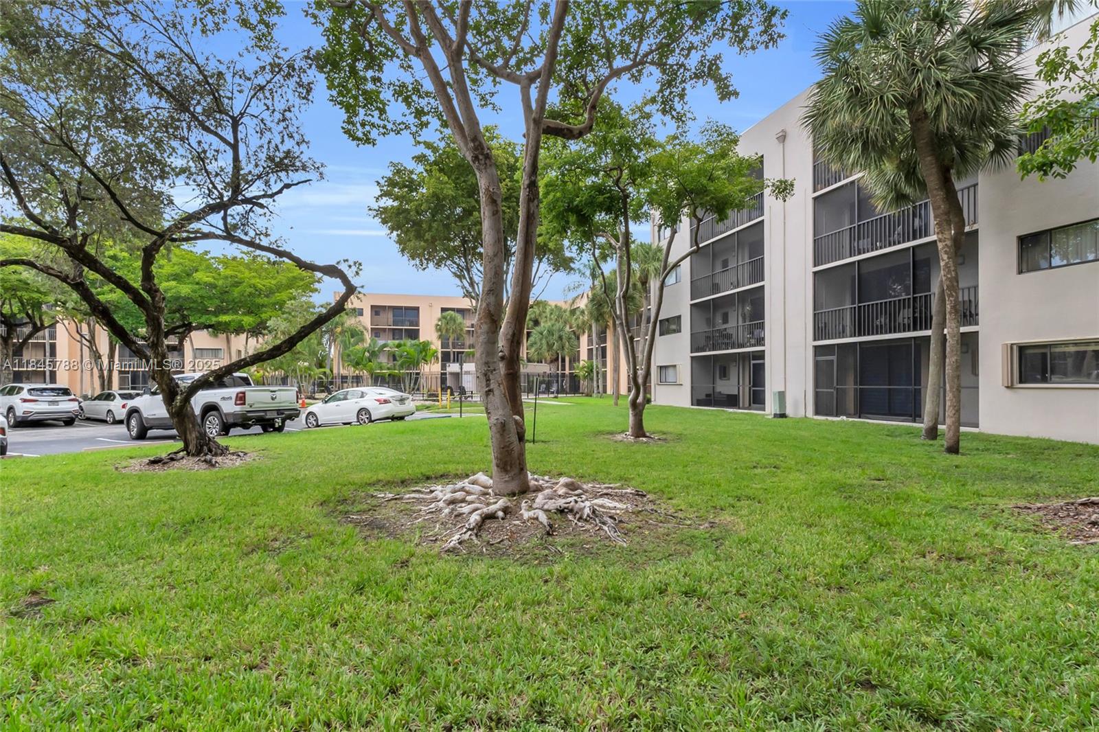 8760 Southwest 133rd Avenue Road, Unit 108 Miami, FL 33183 - Photo 37 of 39 a view of a garden with a tree in front of the house