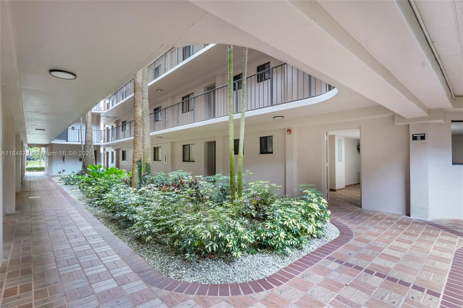 8760 Southwest 133rd Avenue Road, Unit 108 Miami, FL 33183 - Photo 38 of 39 a view of a building with potted plants