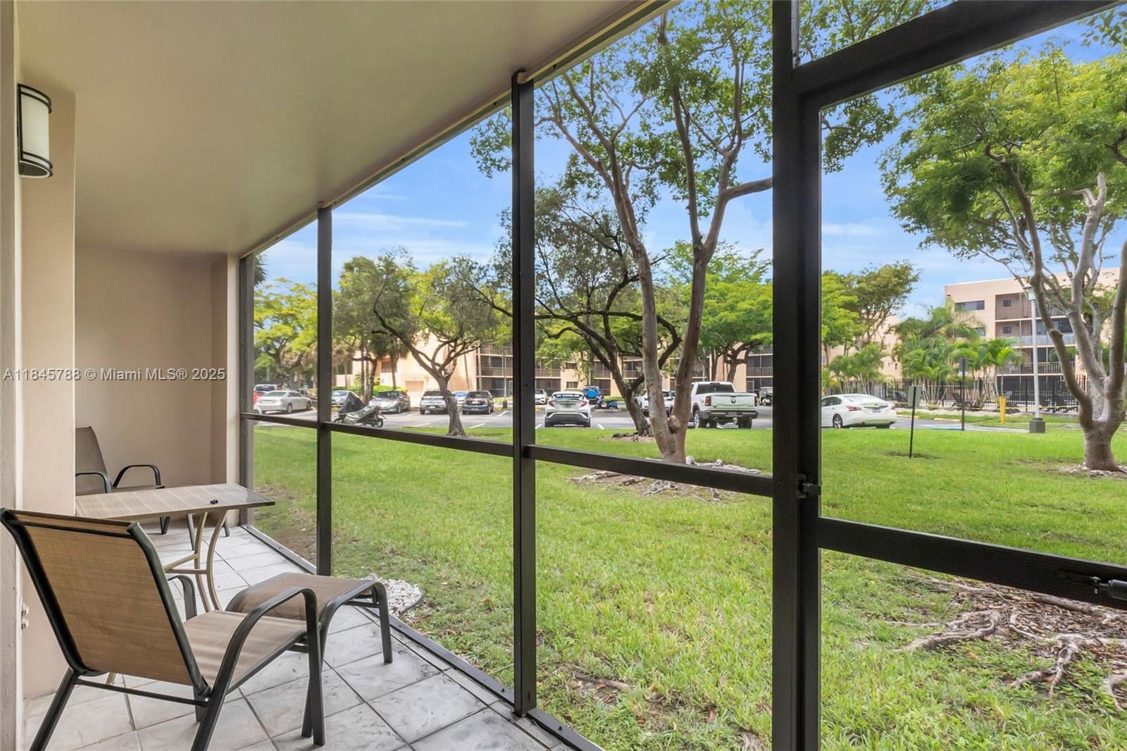 8760 Southwest 133rd Avenue Road, Unit 108 Miami, FL 33183 - Photo 8 of 39 a view of backyard with swimming pool and outdoor seating
