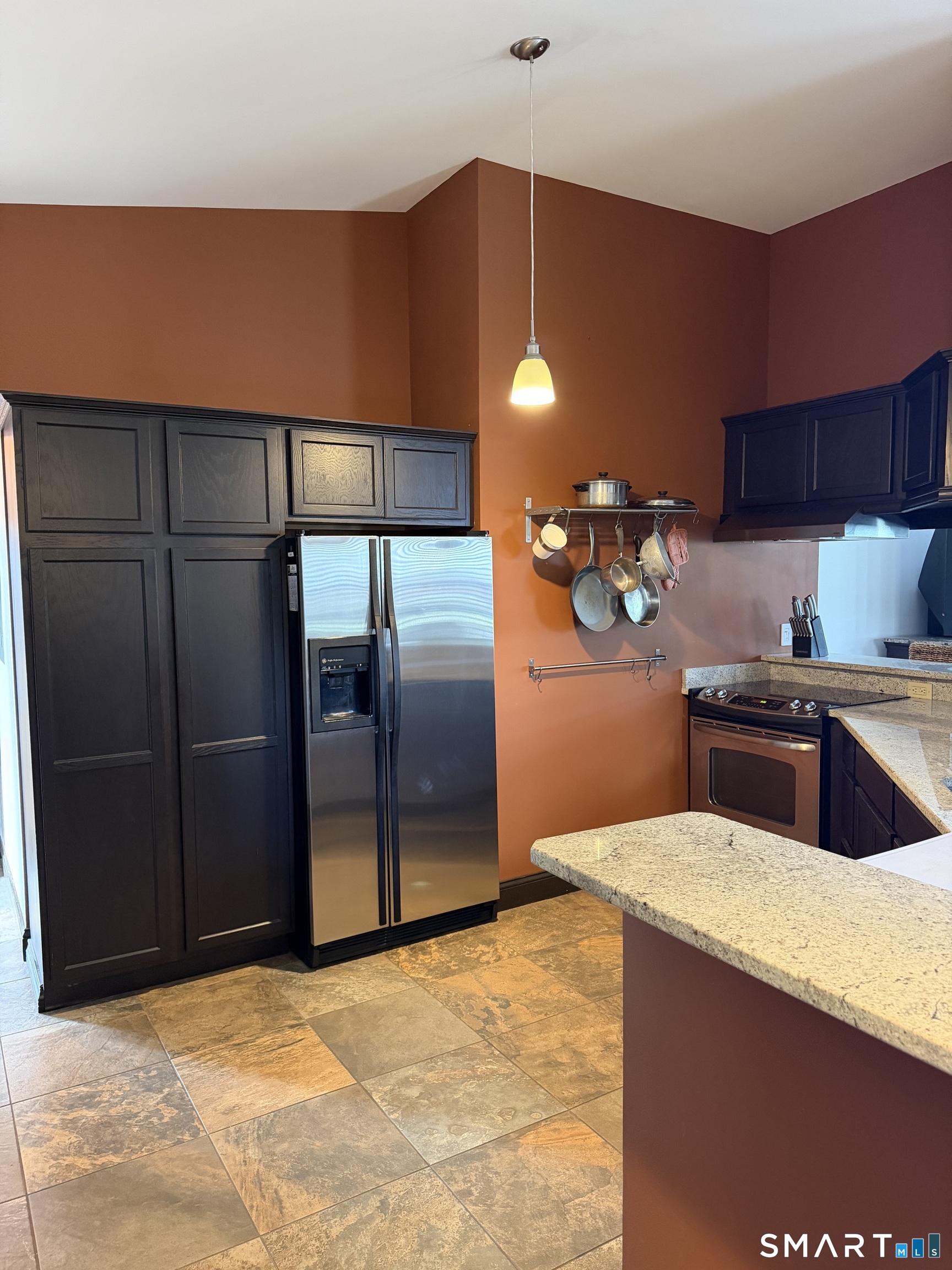 10 Summit Street, Unit 1 East Hampton, CT 06424 - Photo 2 of 14 a kitchen with stainless steel appliances a refrigerator and a microwave