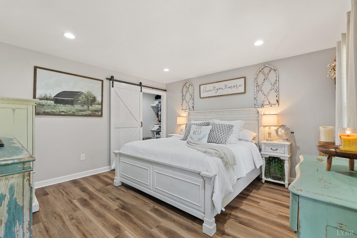 4607 Lowry Road Goode, VA 24556 - Photo 17 of 64 a bed room with a bed and a table