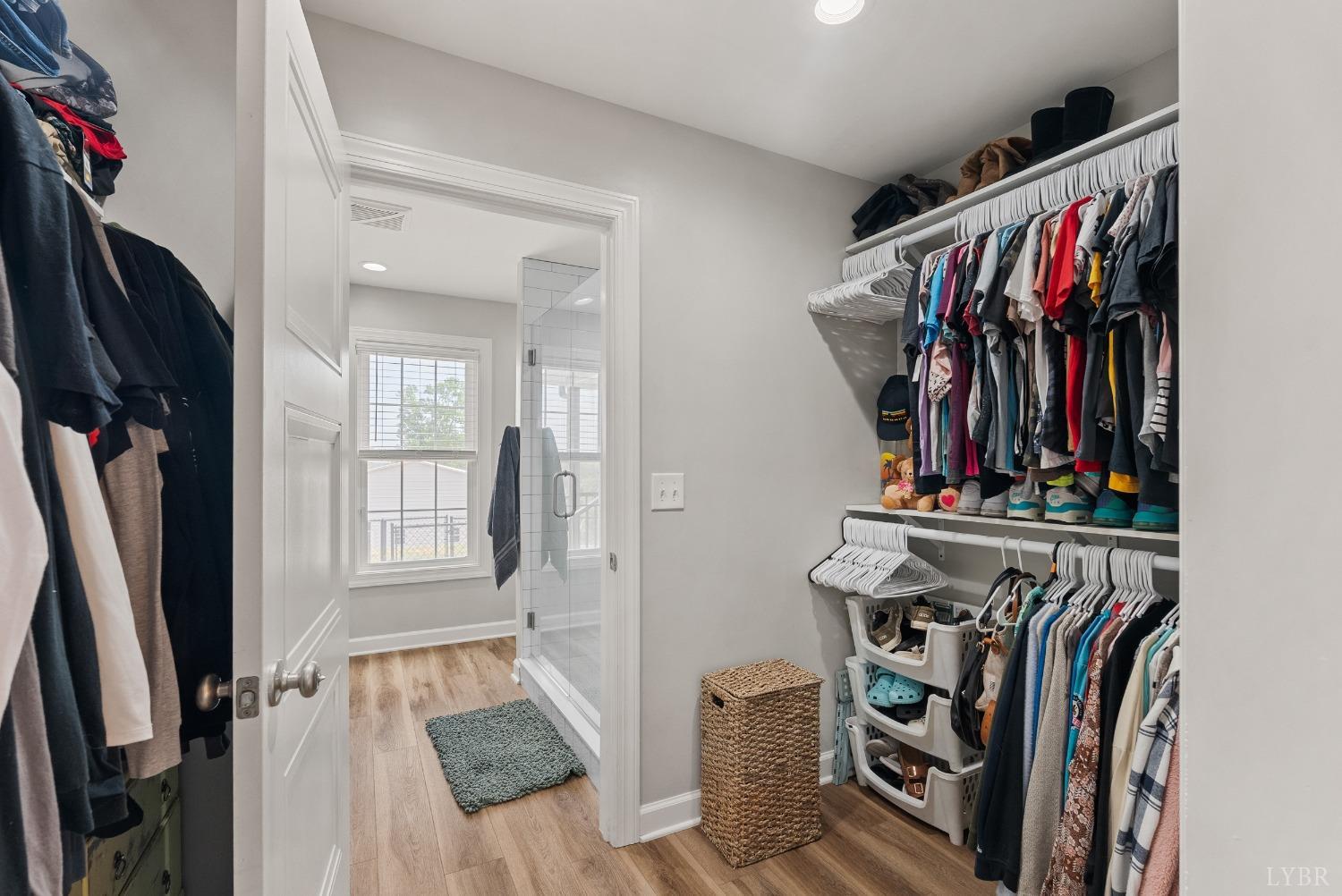 4607 Lowry Road Goode, VA 24556 - Photo 19 of 64 a view of walk in closet with clothes and shoes