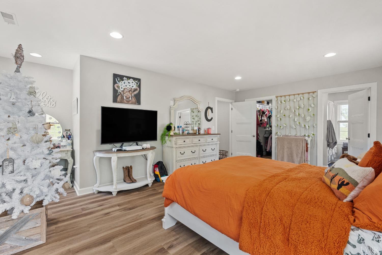 4607 Lowry Road Goode, VA 24556 - Photo 24 of 64 a bedroom with a bed and a flat screen tv