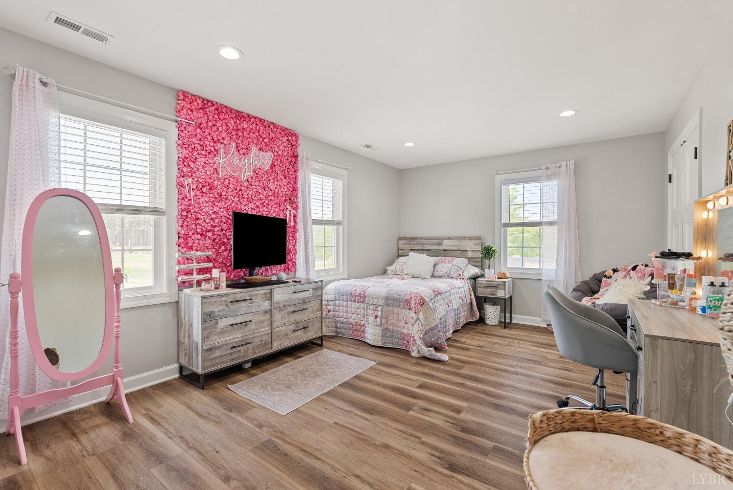 4607 Lowry Road Goode, VA 24556 - Photo 34 of 64 a bedroom with furniture and a flat screen tv