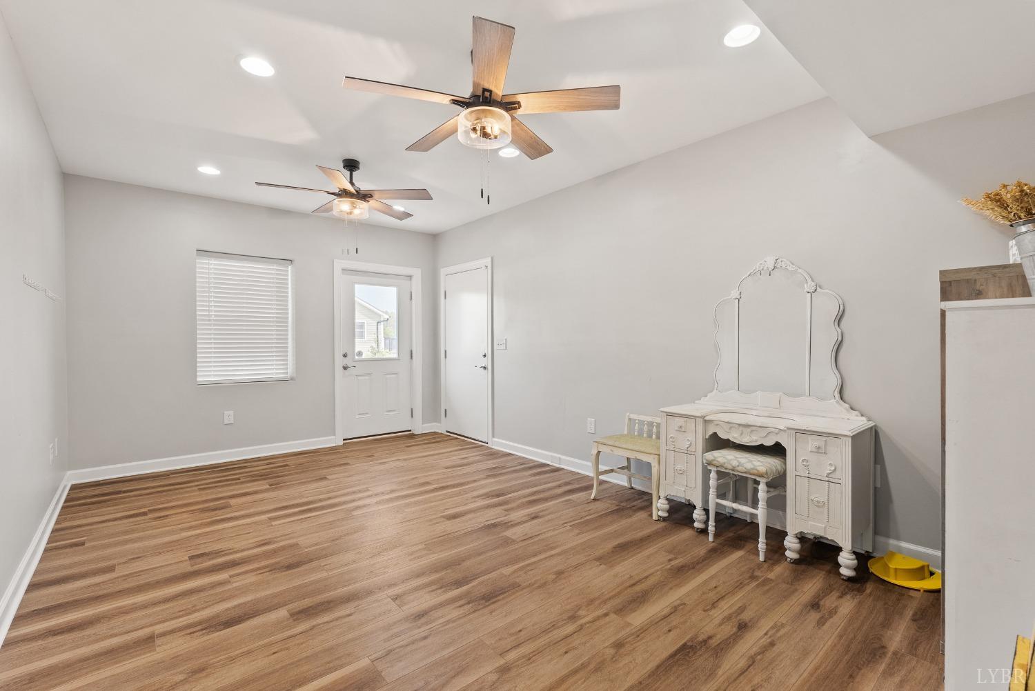 4607 Lowry Road Goode, VA 24556 - Photo 39 of 64 a view of a room with wooden floor and ceiling fan