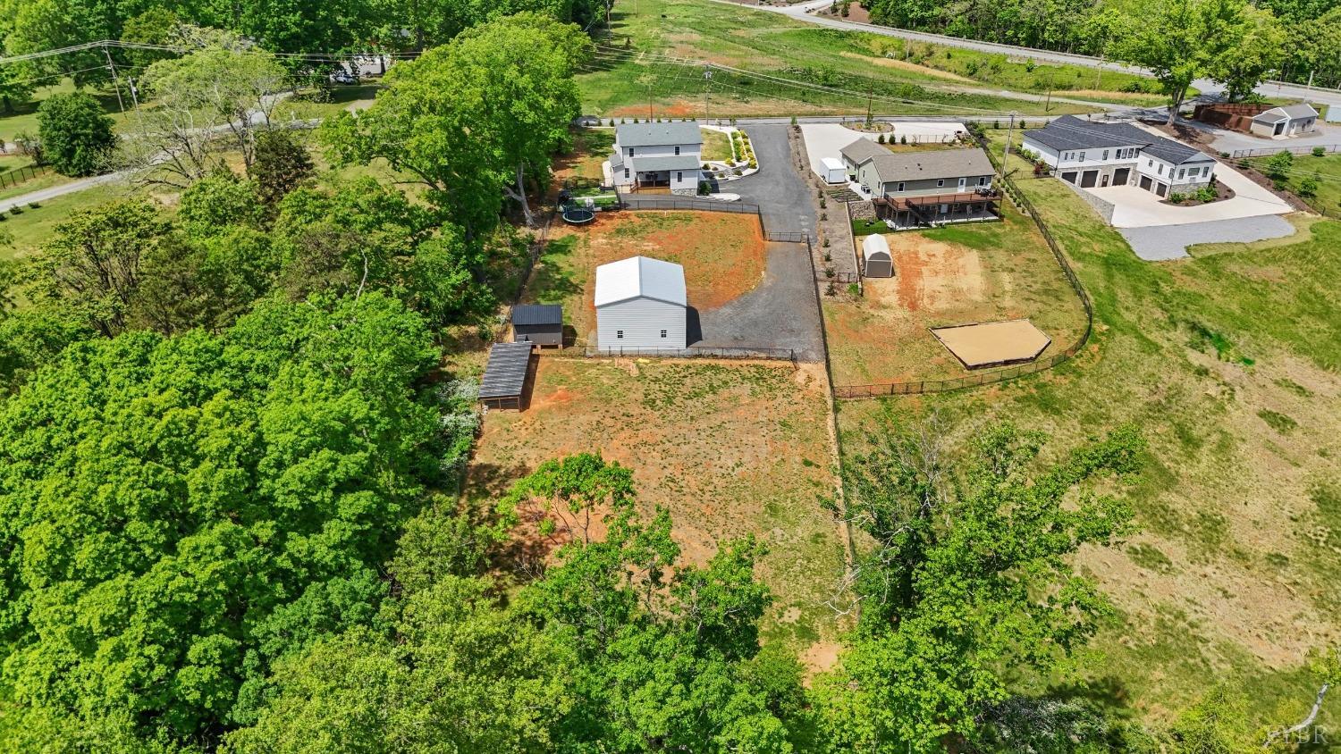 4607 Lowry Road Goode, VA 24556 - Photo 46 of 64 an aerial view of residential houses with outdoor space and trees