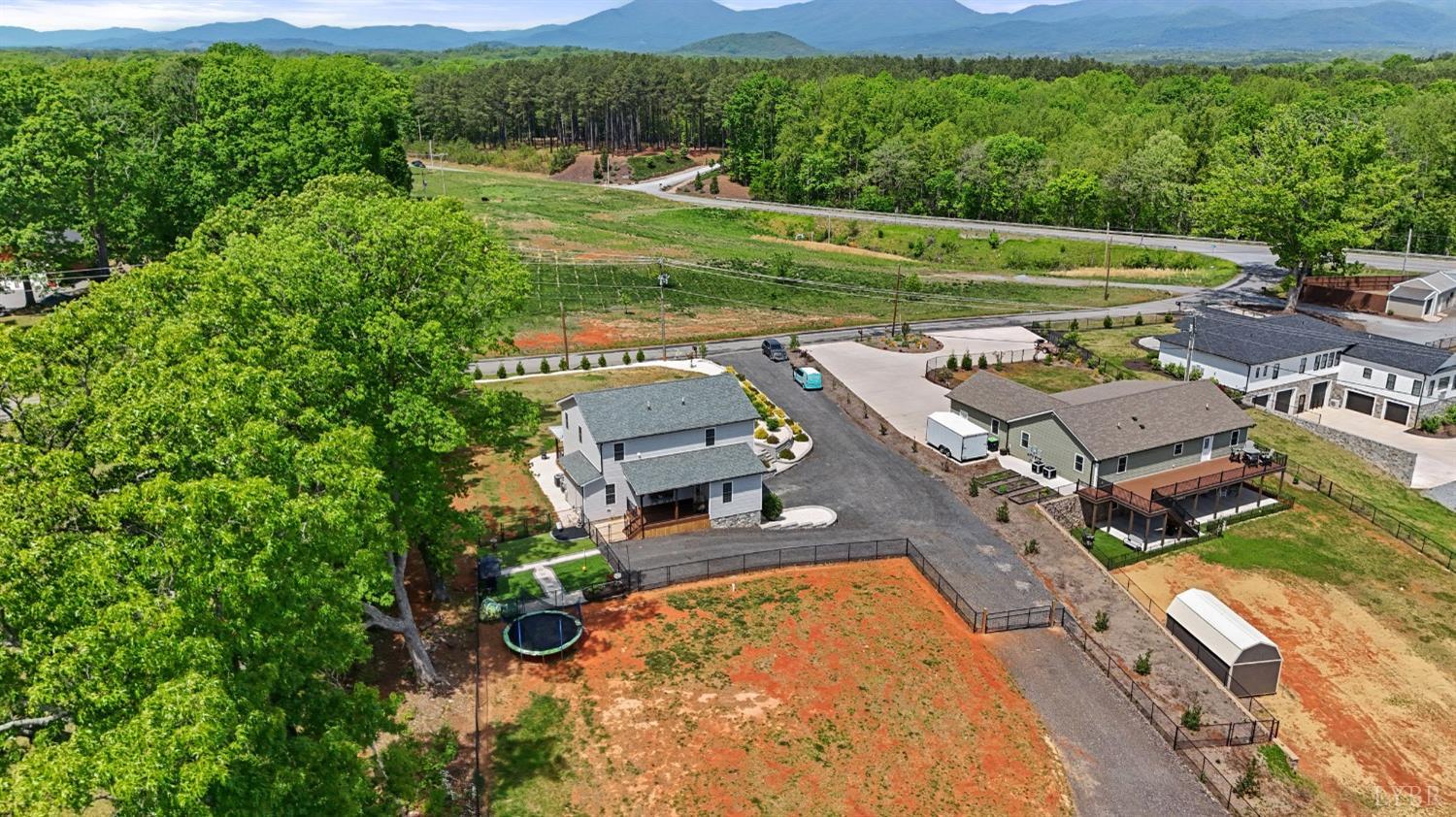 4607 Lowry Road Goode, VA 24556 - Photo 47 of 64 an aerial view of a house with a garden