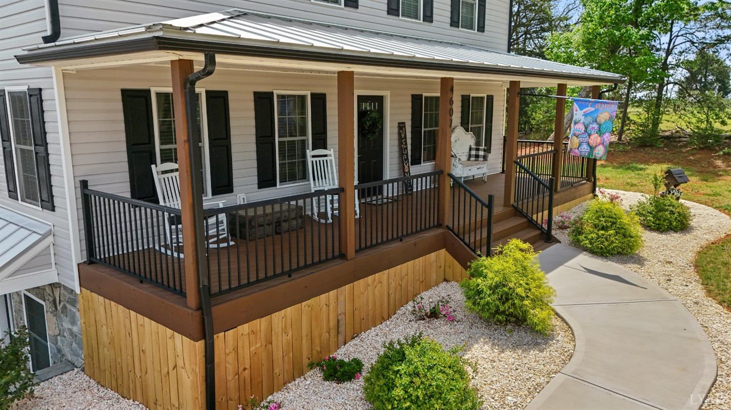 4607 Lowry Road Goode, VA 24556 - Photo 50 of 64 a front view of a house with a porch