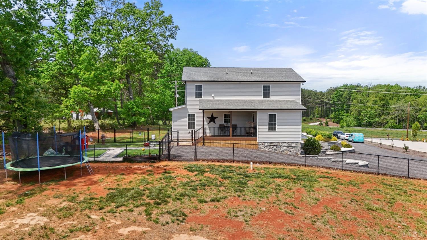 4607 Lowry Road Goode, VA 24556 - Photo 57 of 64 a front view of a house with garden