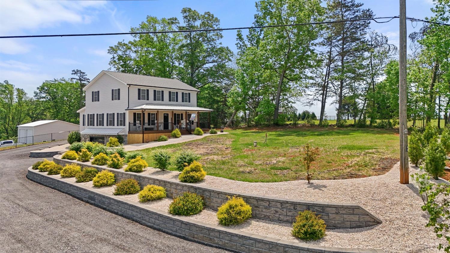 4607 Lowry Road Goode, VA 24556 - Photo 61 of 64 a front view of a house with garden