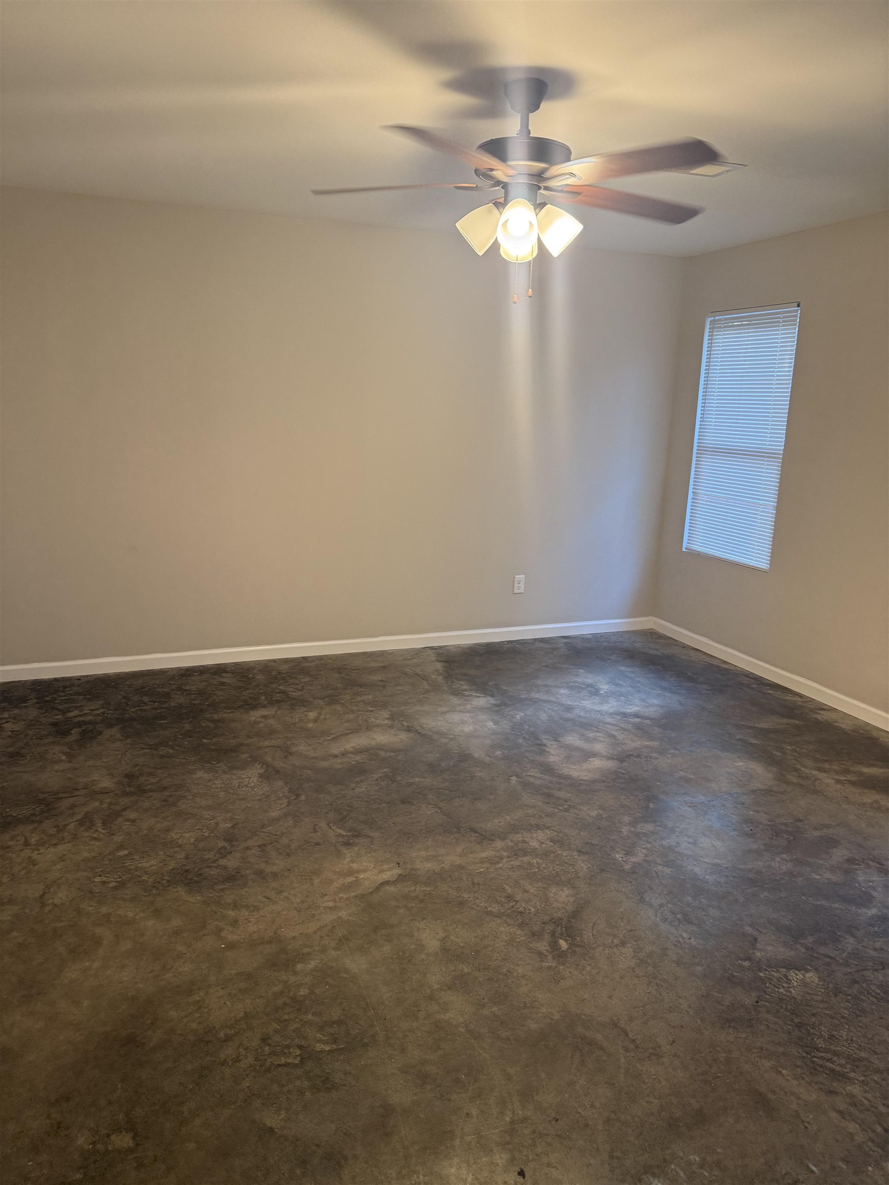4589 Range Line Road Memphis, TN 38127 - Photo 9 of 25 Unfurnished room featuring concrete floors and a ceiling fan
