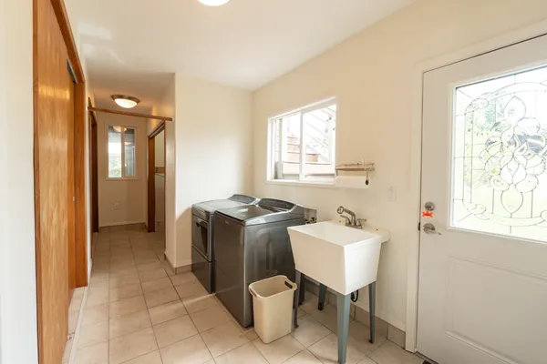 a bathroom with a sink toilet and mirror