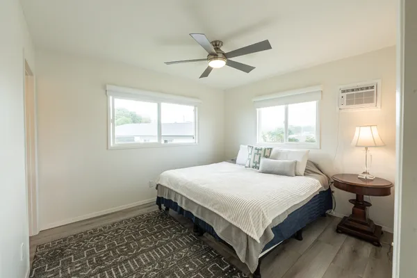 a bedroom with a bed and window