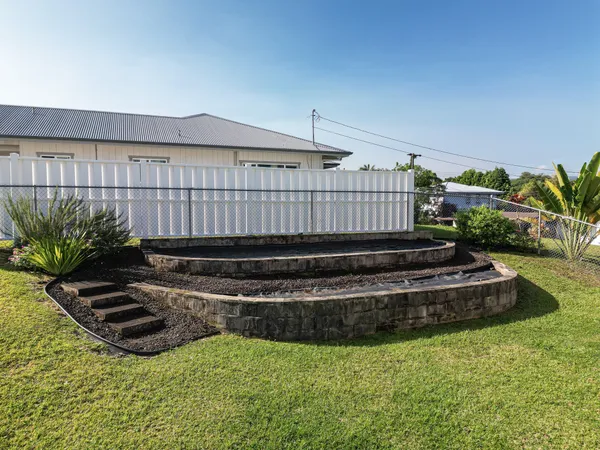 a view of a backyard with plants