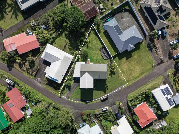 an aerial view of house with yard
