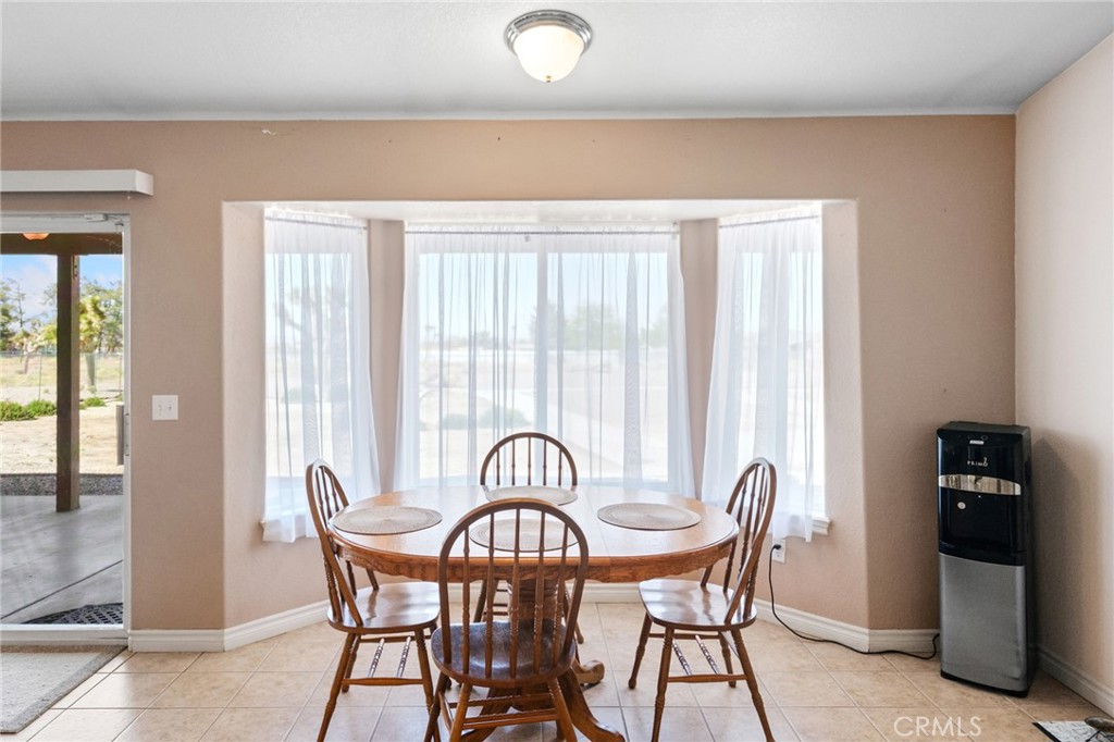 11025 El Esteban Road Phelan, CA 92371 - Photo 17 of 54 a view of a dining room with furniture and window