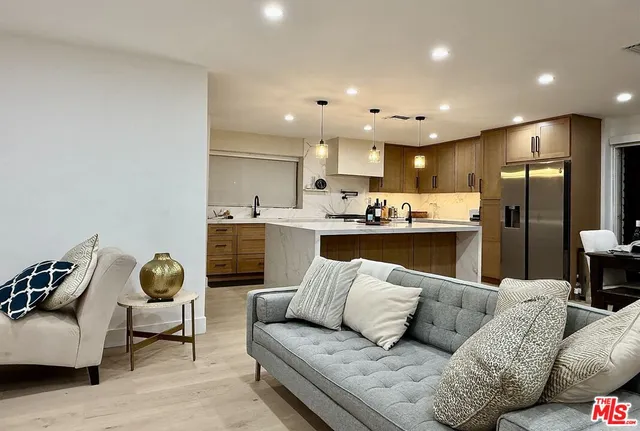 a living room with a couch and a cabinet