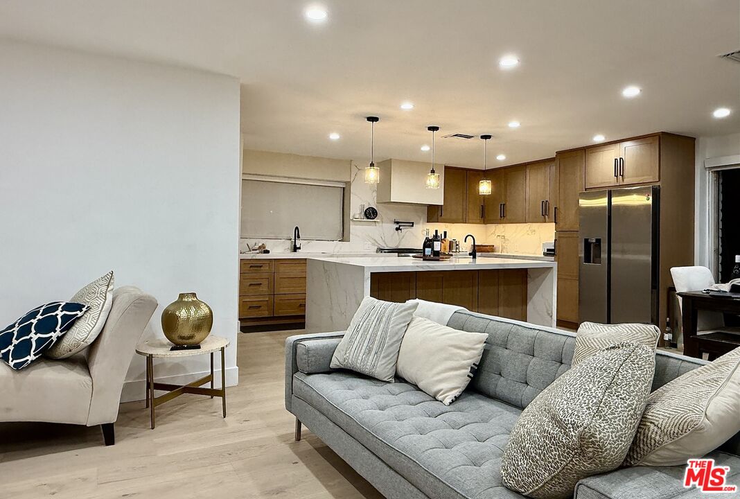 a living room with a couch and a cabinet