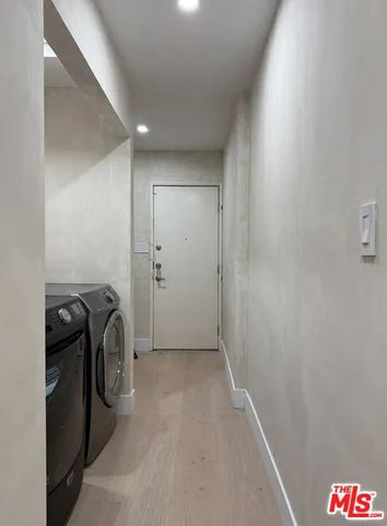 a view of a storage & utility room with washer and dryer
