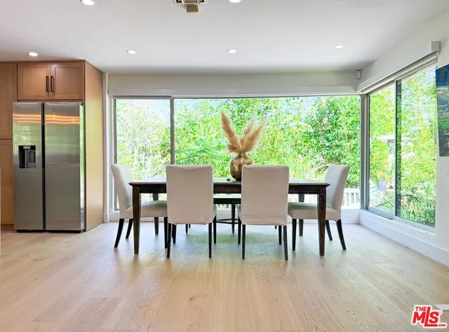 a dining room with furniture window wooden floor