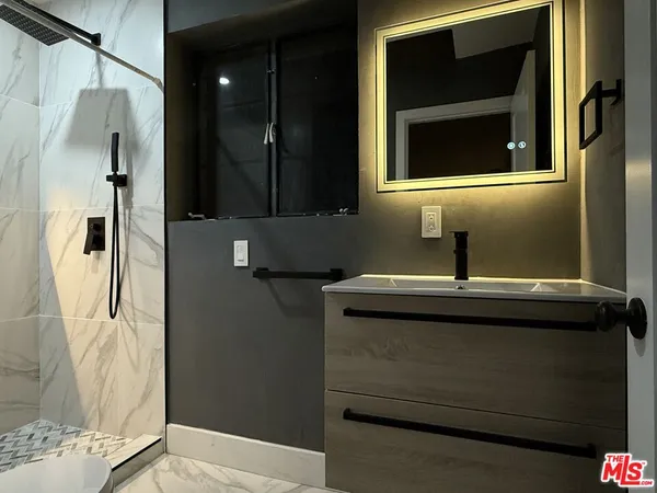 a bathroom with a sink and a mirror