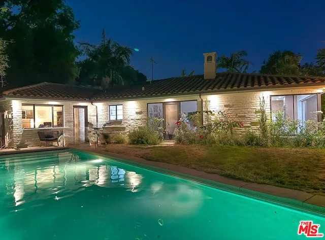 a view of a house with a swimming pool