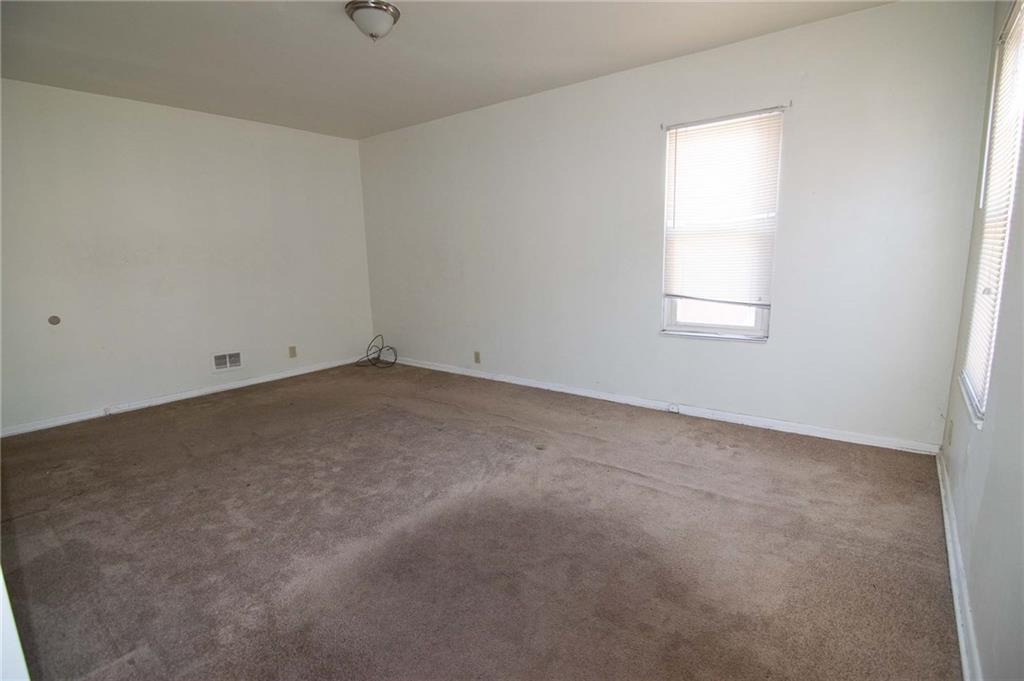 238 Fleet Street Braddock, PA 15104 - Photo 12 of 14 an empty room with a window