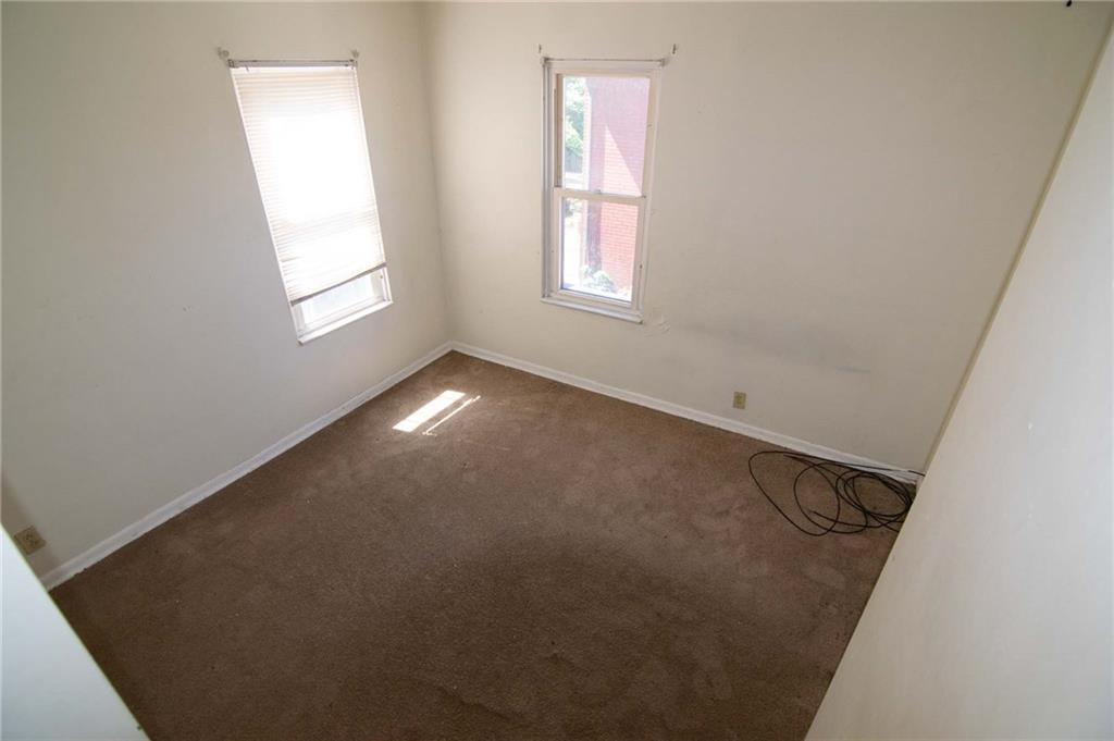 238 Fleet Street Braddock, PA 15104 - Photo 10 of 14 an empty room with windows