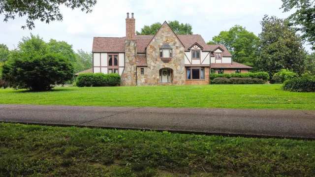 an aerial view of house with yard