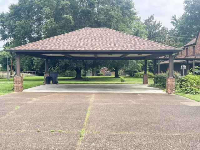 front view of a house next to a yard