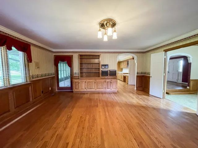 a view of fireplace with a wooden door