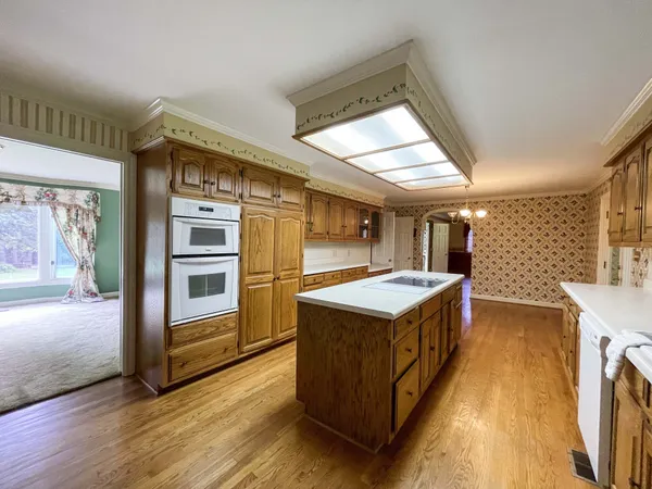 a spacious bathroom with a double vanity sink and a mirror