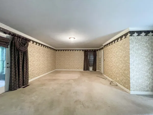 a view of an empty room and window