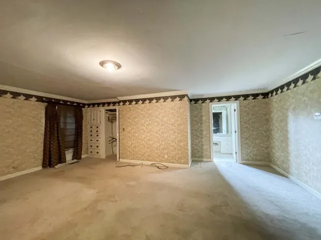 a bathroom with a bathtub and shower