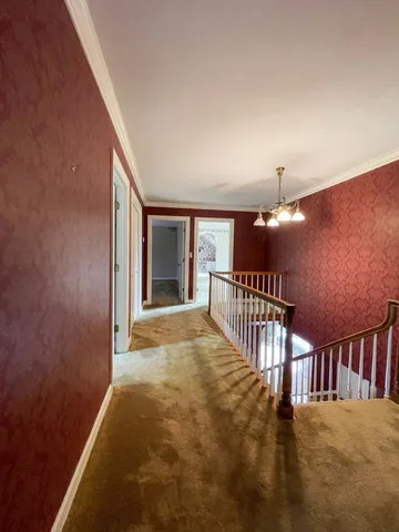 a black and white photo of a white refrigerator