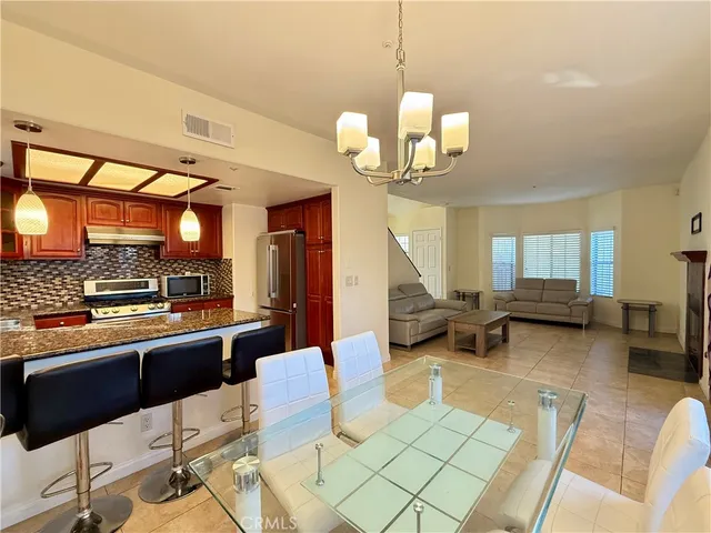 a very nice looking room with a large window and furniture